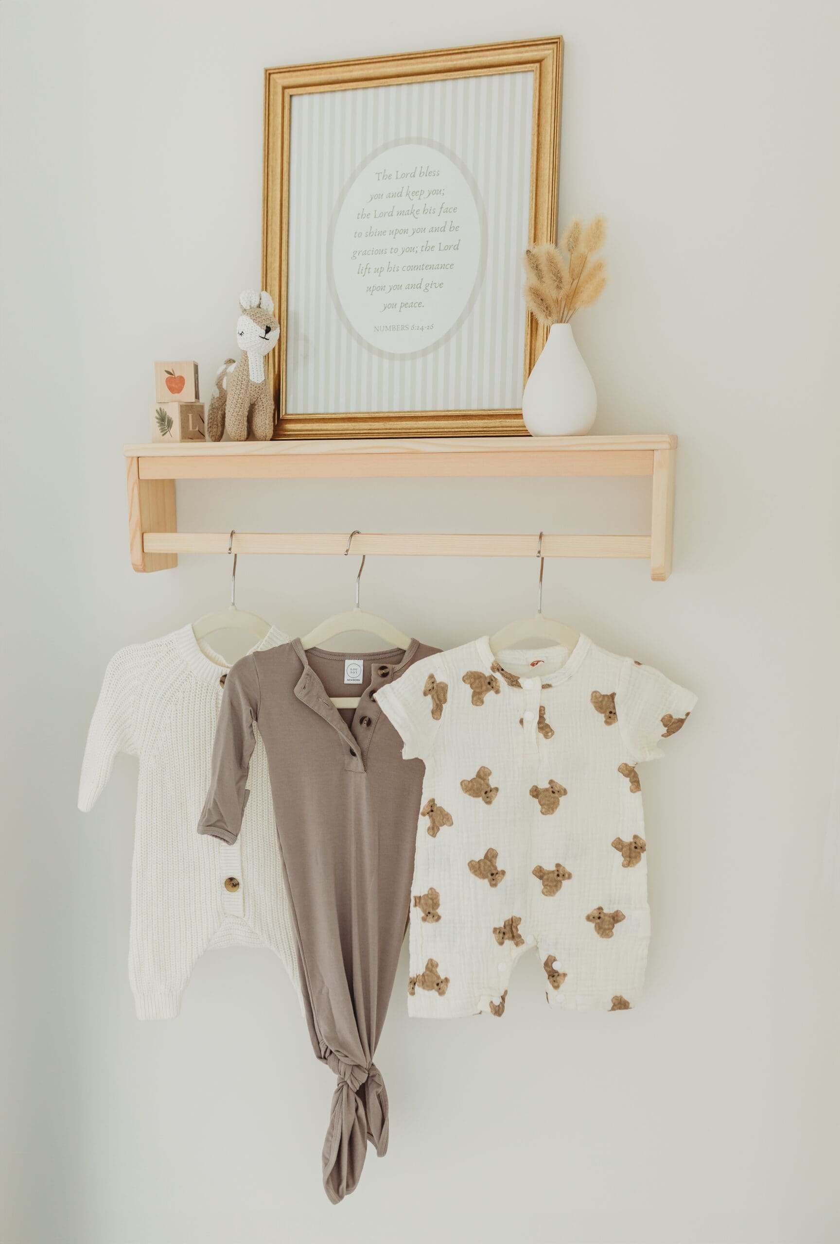 Storefronts and gift displays at three locally owned Knoxville baby boutiques—Knox Smocks, The Village Exchange, and Little Happy—offering baby clothing, toys, accessories, and unique baby shower gifts.